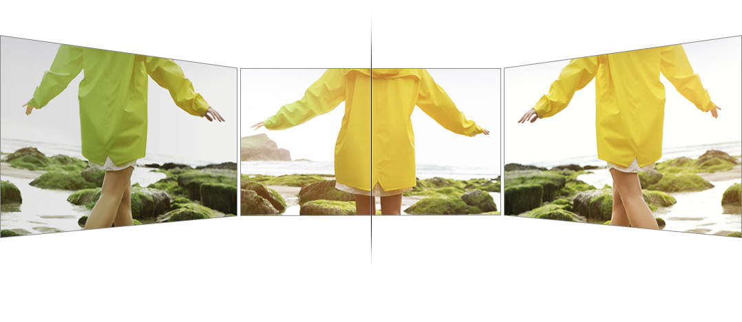 There are 3 TVs; one is placed on the front screen and others are obliquely on the left/ right sides. Based on the front, we can see others TVs in the left side and QLED TV in the right side. Yellow raincoat is indicated as dark and green one on others TVs, but it is shown clear and vivid yellow one on the QLED TV.